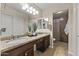 Bathroom featuring a dual sink granite vanity and an enclosed walk-in shower, offering luxury and functionality at 10747 W Via Del Sol --, Peoria, AZ 85373