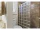 Well-lit bathroom featuring a glass block shower, granite countertop, and modern fixtures at 10747 W Via Del Sol --, Peoria, AZ 85373