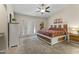 Spacious bedroom with a platform bed, built-in storage, doors to the outside, and a ceiling fan at 10747 W Via Del Sol --, Peoria, AZ 85373