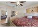 Bedroom featuring a comfortable bed with a decorative pillow, and a view into the adjacent living area at 10747 W Via Del Sol --, Peoria, AZ 85373