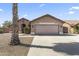 Charming single-story home with desert landscaping, a wide driveway, and a two-car garage at 10747 W Via Del Sol --, Peoria, AZ 85373