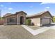 Charming single-story home with desert landscaping, tile roof, and inviting entrance at 10747 W Via Del Sol --, Peoria, AZ 85373