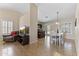 Open-concept living space with dining area and a glimpse into the modern kitchen at 10747 W Via Del Sol --, Peoria, AZ 85373