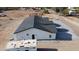 New construction featuring a gray roof, neutral colored stucco, black window trim, and low maintenance yard at 11798 S 216Th Ave, Buckeye, AZ 85326