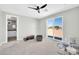 Bedroom with ceiling fan, access to the bathroom and sliding glass doors to enjoy the natural light at 11798 S 216Th Ave, Buckeye, AZ 85326