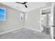 Empty bedroom with a ceiling fan and windows that provide natural light at 11798 S 216Th Ave, Buckeye, AZ 85326