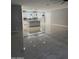 Open-concept kitchen boasts white cabinets, pendant lighting, and granite countertops at 11798 S 216Th Ave, Buckeye, AZ 85326