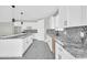 New kitchen with white cabinets, granite counters, and stainless steel sink at 11798 S 216Th Ave, Buckeye, AZ 85326