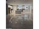 Open-concept kitchen boasts white cabinets, pendant lighting, and granite countertops at 11798 S 216Th Ave, Buckeye, AZ 85326