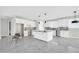 Spacious kitchen featuring white cabinets, gray countertops, and tile flooring at 11798 S 216Th Ave, Buckeye, AZ 85326