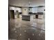 Bright kitchen with white cabinetry, granite countertops, and large center island at 11798 S 216Th Ave, Buckeye, AZ 85326