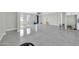 Bright living room with new tile flooring and modern ceiling fan at 11798 S 216Th Ave, Buckeye, AZ 85326