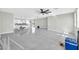 Spacious living space featuring sleek tile flooring, bright walls, and open-concept design at 11798 S 216Th Ave, Buckeye, AZ 85326