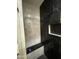 Luxurious shower with sleek black marble tiles, recessed niche, and modern fixtures at 11798 S 216Th Ave, Buckeye, AZ 85326