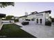 Backyard with outdoor furniture, artificial grass, travertine patio, and pool at 1249 E Desert Park Ln, Phoenix, AZ 85020