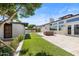 Expansive backyard featuring manicured lawn, a modern pool, patio area, and chic outdoor furniture at 1249 E Desert Park Ln, Phoenix, AZ 85020