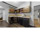 Bar area with custom wood cabinets, and a built in sink at 1249 E Desert Park Ln, Phoenix, AZ 85020