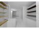 A brightly-lit basement storage area has painted brick walls and wood and dark wood shelving at 1249 E Desert Park Ln, Phoenix, AZ 85020