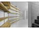 A bright basement storage room is equipped with wooden shelving for organization at 1249 E Desert Park Ln, Phoenix, AZ 85020