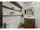 Bathroom featuring wood shelving, tile flooring, and a stylish sink vanity at 1249 E Desert Park Ln, Phoenix, AZ 85020