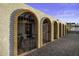 Charming home featuring arched entryways with wrought iron gates and brick accents at 1249 E Desert Park Ln, Phoenix, AZ 85020