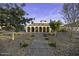 Beautiful home featuring arched entryways, wrought iron gates, manicured desert landscaping, and brick driveway at 1249 E Desert Park Ln, Phoenix, AZ 85020
