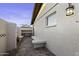 Exterior of home with a small patio with concrete benches and stone ground at 1249 E Desert Park Ln, Phoenix, AZ 85020