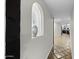 Bright hallway with a stylish alcove, leading to the kitchen at 1249 E Desert Park Ln, Phoenix, AZ 85020