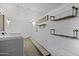 Bright laundry room with open shelving and washer and dryer at 1249 E Desert Park Ln, Phoenix, AZ 85020