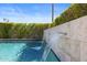 The tranquil pool boasts elegant waterfall features, complemented by lush landscaping and clear blue water at 1249 E Desert Park Ln, Phoenix, AZ 85020