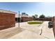 Spacious backyard featuring block walls for privacy, large patio, and small patch of artificial turf at 1330 E Monte Vista Rd, Phoenix, AZ 85006