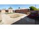 Spacious backyard featuring block walls for privacy, large patio, and small patch of artificial turf at 1330 E Monte Vista Rd, Phoenix, AZ 85006
