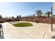 Spacious backyard featuring block walls for privacy, large patio, and small patch of artificial turf at 1330 E Monte Vista Rd, Phoenix, AZ 85006