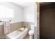 Bathroom featuring a bath tub and tiled walk in shower at 1330 E Monte Vista Rd, Phoenix, AZ 85006