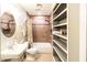 Cozy bathroom with tub, open shelving and neutral-toned tile at 1330 E Monte Vista Rd, Phoenix, AZ 85006