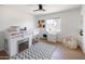 Bright bedroom with a lofted bed, gray rug, beanbag chair, and a window view at 1330 E Monte Vista Rd, Phoenix, AZ 85006