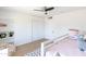 Bright bedroom with a lofted bed, beanbag chair, white sliding closet doors and built-in shelving at 1330 E Monte Vista Rd, Phoenix, AZ 85006