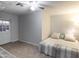 This spacious bedroom includes a ceiling fan and natural light from the door at 1330 E Monte Vista Rd, Phoenix, AZ 85006