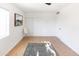 Bright bedroom with white sliding closet doors, a clear chair, gray rug, and a ceiling fan at 1330 E Monte Vista Rd, Phoenix, AZ 85006