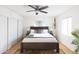 Bright bedroom with a ceiling fan, oriental rug, white sliding closet doors and two windows at 1330 E Monte Vista Rd, Phoenix, AZ 85006