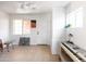 Bonus room features a ceiling fan, art and a keyboard at 1330 E Monte Vista Rd, Phoenix, AZ 85006