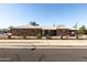 Charming red brick home features a tidy yard enclosed with a black decorative metal fence at 1330 E Monte Vista Rd, Phoenix, AZ 85006