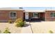 Front exterior features a brick facade and tidy desert landscaping, with a walkway to the front door at 1330 E Monte Vista Rd, Phoenix, AZ 85006