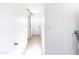 Bright hallway with a sliding barn door and neutral tile floors at 1330 E Monte Vista Rd, Phoenix, AZ 85006