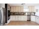 Bright kitchen with white cabinets, granite countertops, and stainless steel appliances at 1330 E Monte Vista Rd, Phoenix, AZ 85006