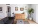 Cozy living room featuring a modern cabinet, artwork, and natural lighting at 1330 E Monte Vista Rd, Phoenix, AZ 85006