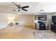 This open-concept living room features tile floors, ceiling fan and flows into the kitchen at 1330 E Monte Vista Rd, Phoenix, AZ 85006