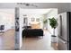 Bright living room with tile floors, plants, and modern stainless steel appliances at 1330 E Monte Vista Rd, Phoenix, AZ 85006