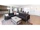 Open concept living room with kitchen featuring a large sofa at 1330 E Monte Vista Rd, Phoenix, AZ 85006