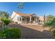 View of the backyard with covered patio and desert landscaping at 13583 S 177Th Ln, Goodyear, AZ 85338